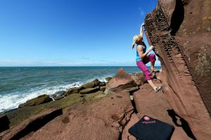 Leah Crane on the uber classic Apiary Arete (Font  5), St Bees, Cumbria